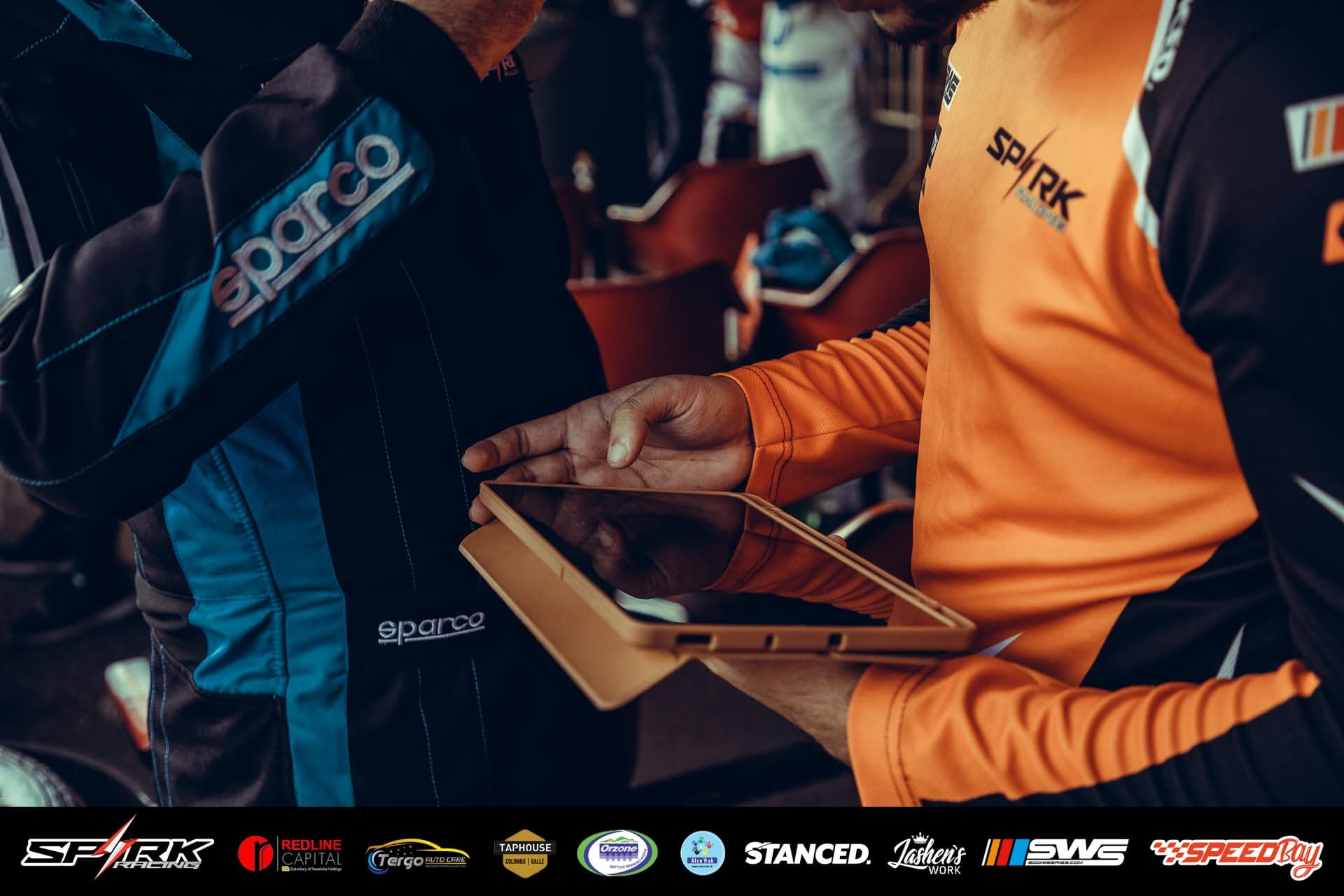 Pit wall strategy briefing before a driver change
